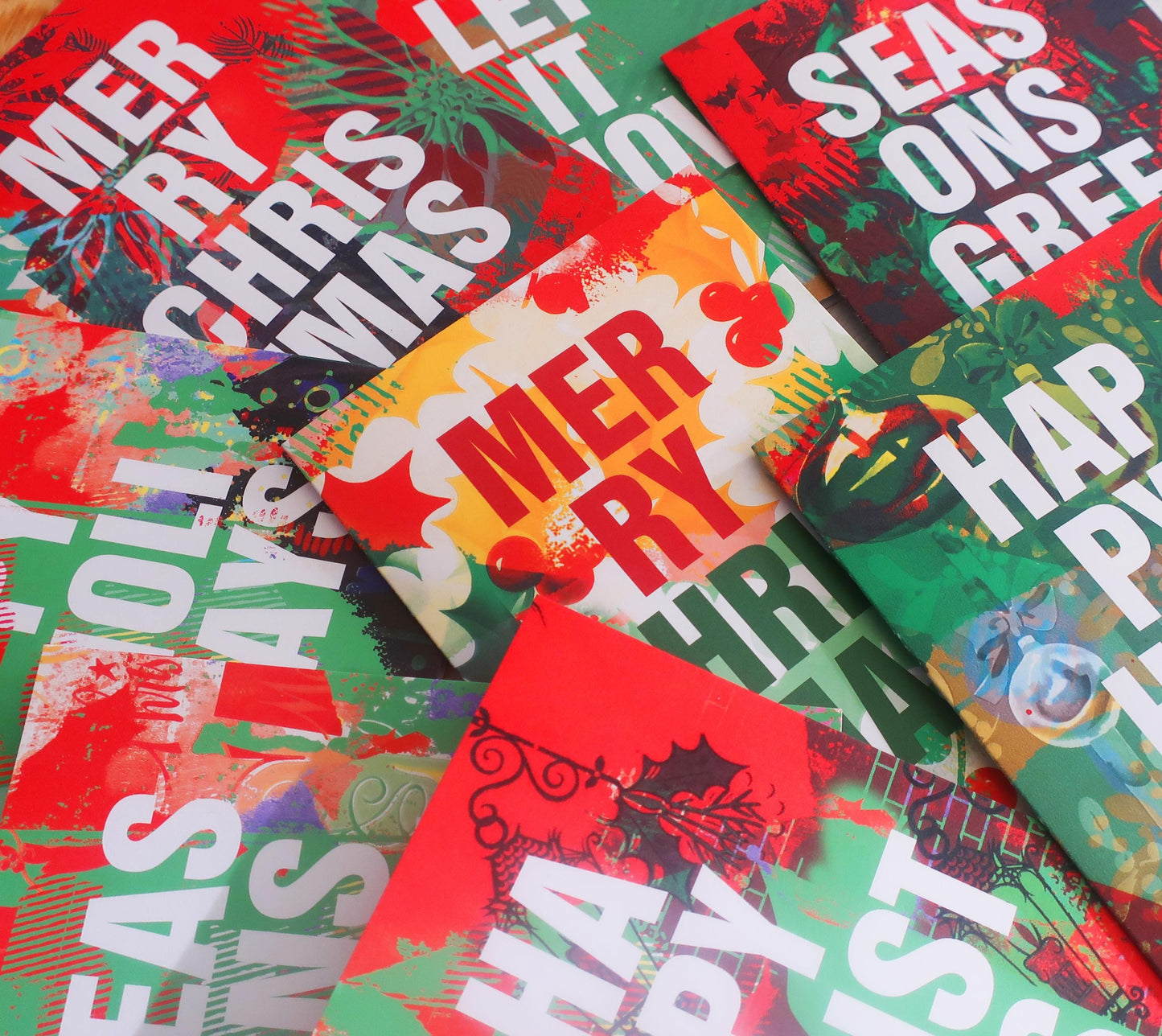 Collection of colorful greeting cards with Christmas-themed text and designs.