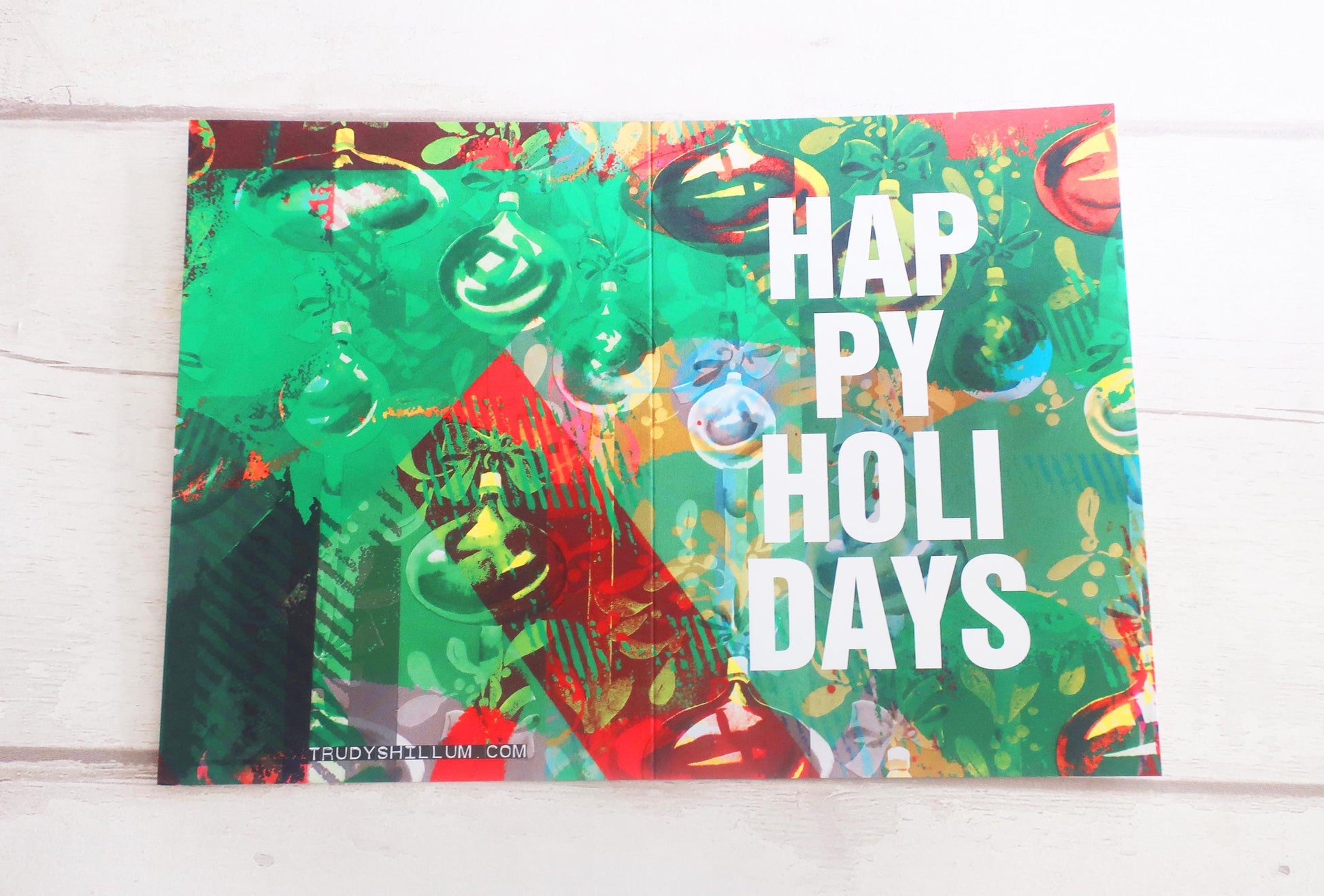 Colorful holiday card with Christmas tree and ornaments on a white background