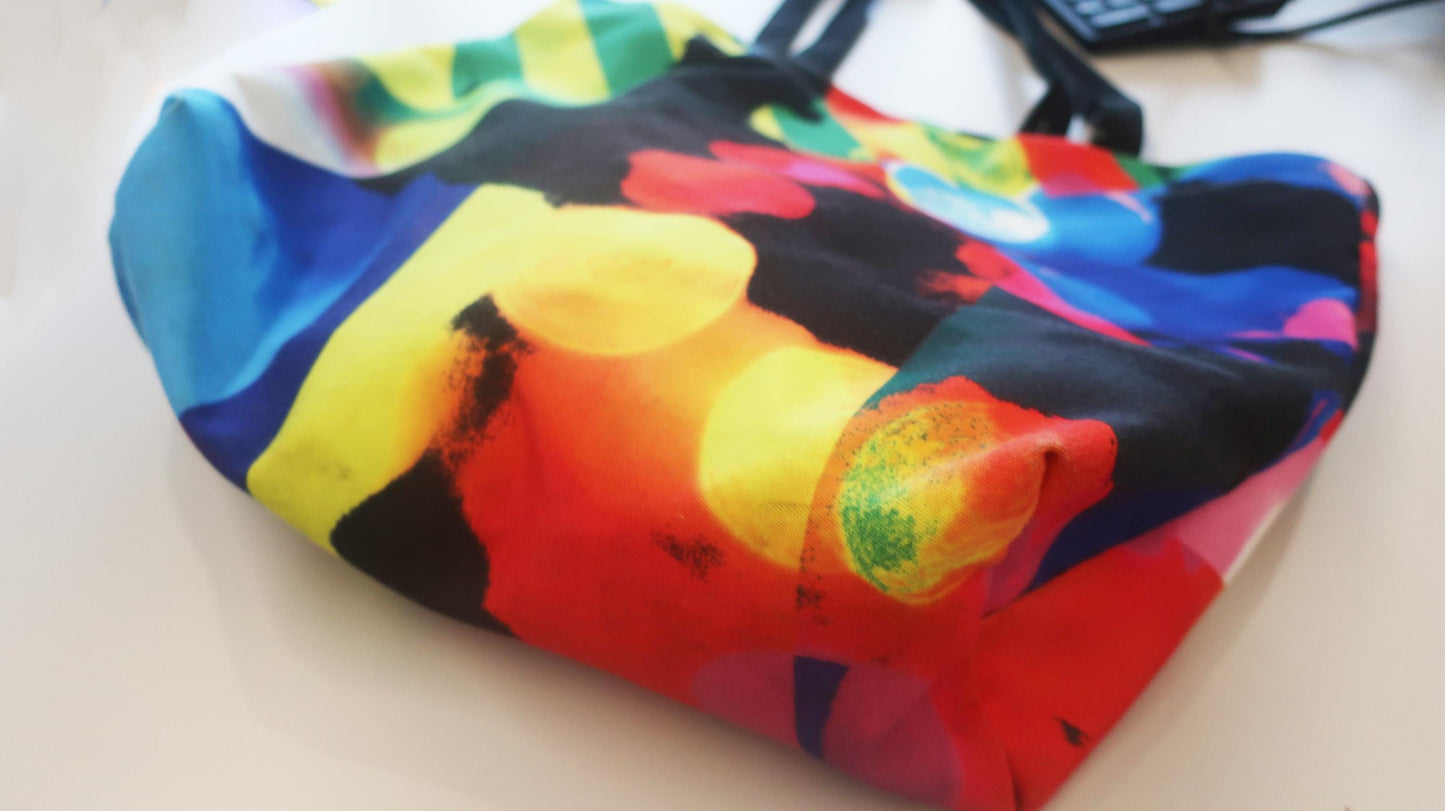 Colorful patterned bag on a white surface