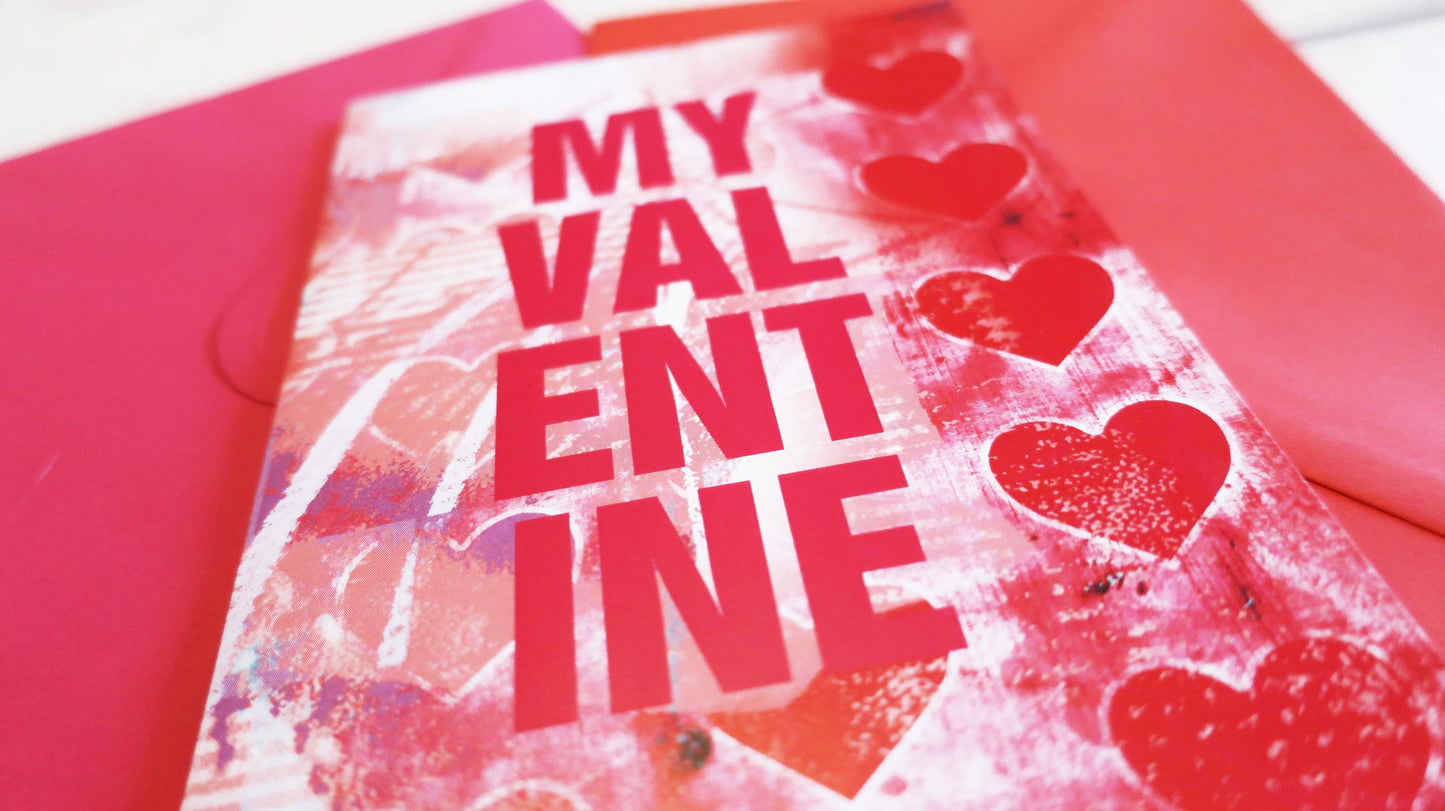 Valentine's Day card with 'My Valentine' text and hearts on a red background