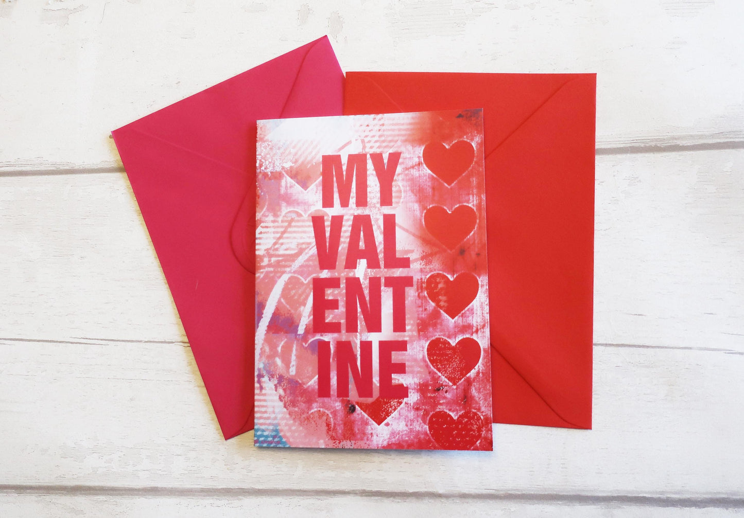 Valentine's Day card with hearts and 'My Valentine' text on a red envelope.
